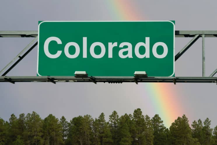 Colorado Sign A sign above a roadway that reads "Colorado". It is a green way finding sign with white text.