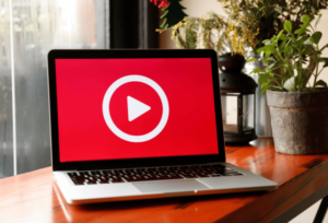 red play button on laptop screen